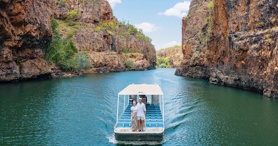 Boat cruising through Katherine Gorge sandstone cliffs